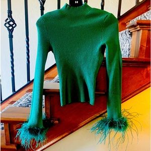 Cutout green sweater with feather sleeves